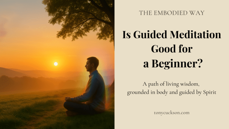 Person meditating at sunrise on a grassy hillside, reflecting on whether guided meditation is helpful for beginners.